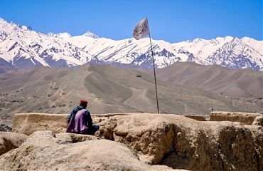 afghanistan mountain with taliban flag.jpg